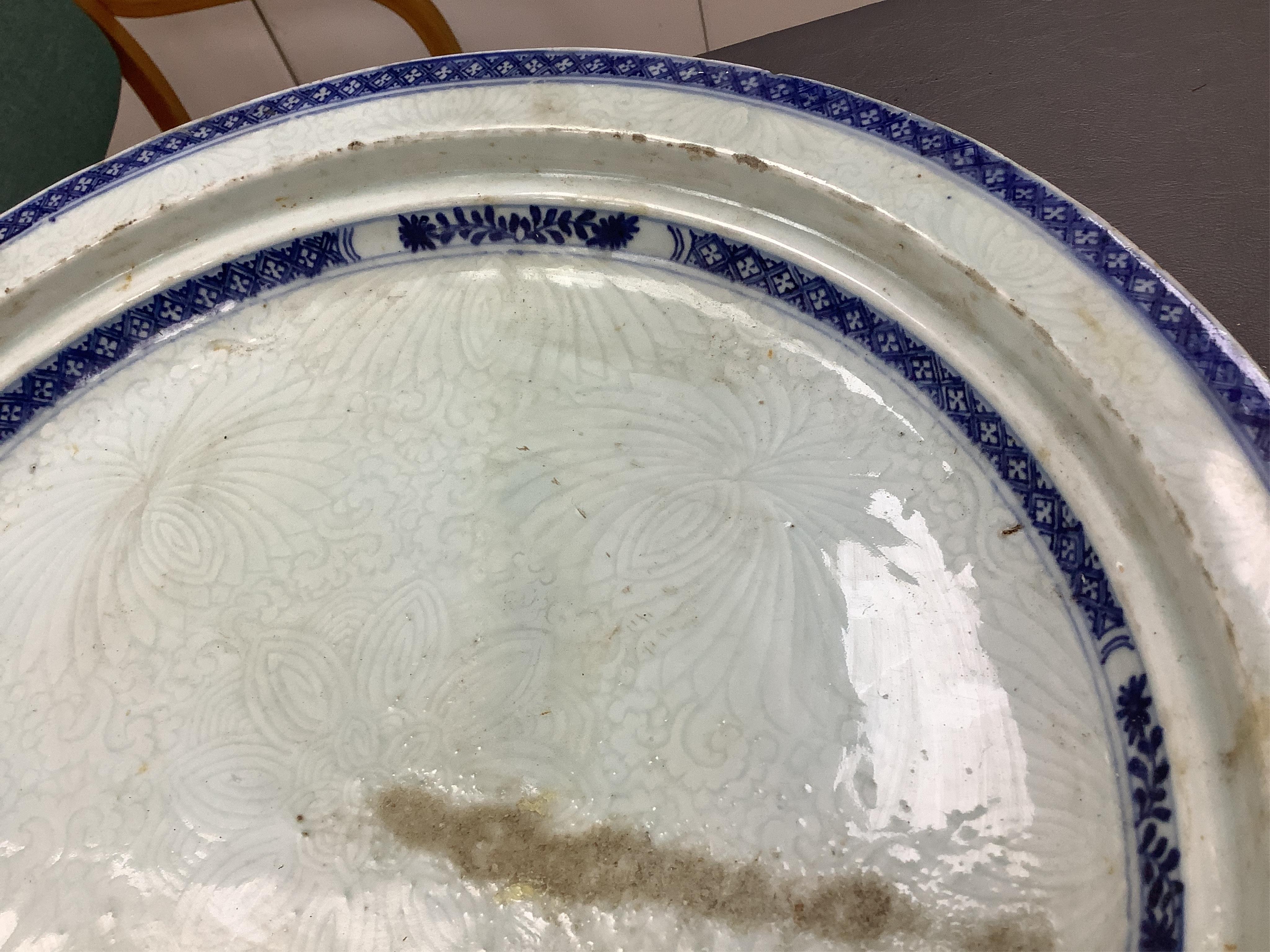 An 18th century Chinese export blue and white chrysanthemum moulded dish, 42cm
